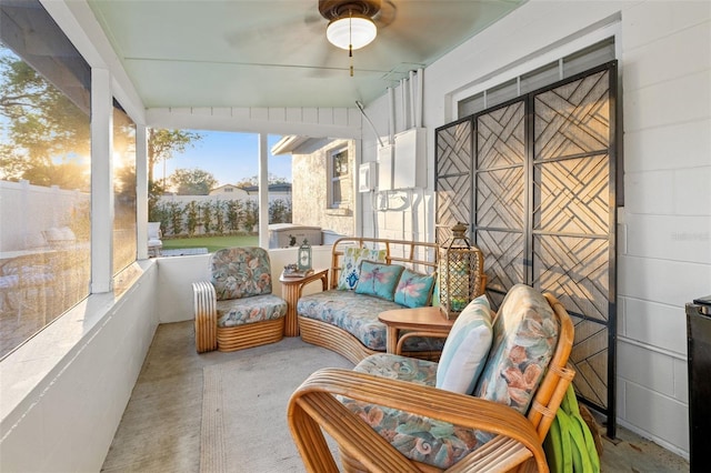 sunroom featuring a ceiling fan