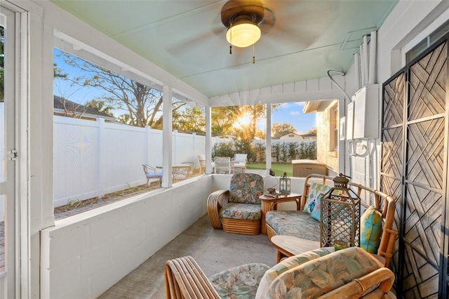 sunroom featuring ceiling fan