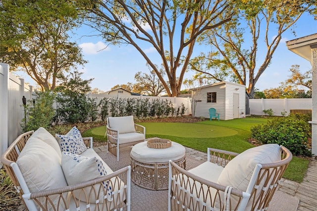 view of patio with a fenced backyard, an outdoor structure, outdoor lounge area, and a shed