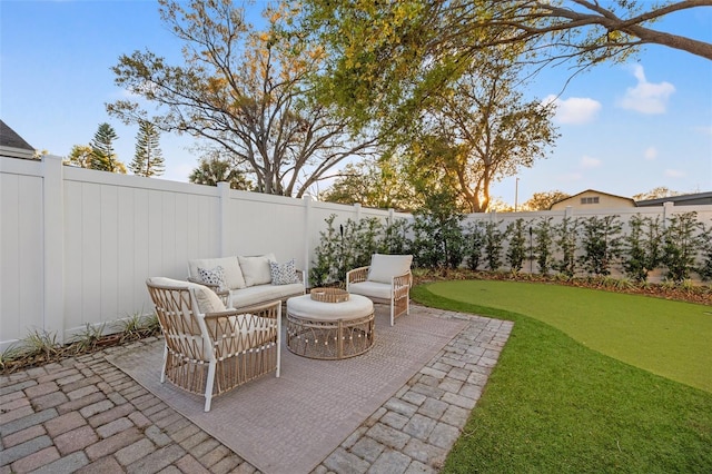 view of patio / terrace featuring an outdoor living space and a fenced backyard