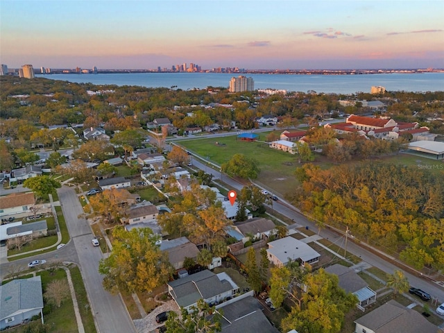 aerial view at dusk with a water view