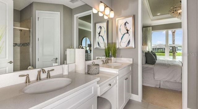 ensuite bathroom featuring a sink, ensuite bath, double vanity, and ornamental molding