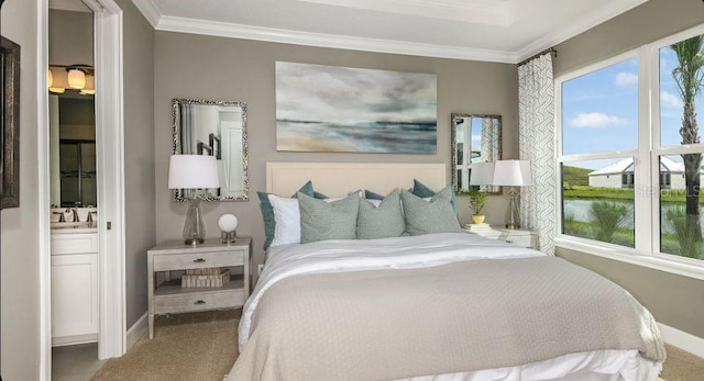 carpeted bedroom with crown molding, baseboards, and a water view