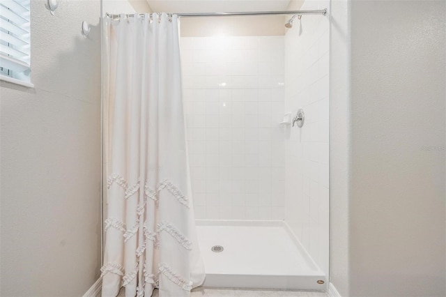 bathroom featuring a shower stall