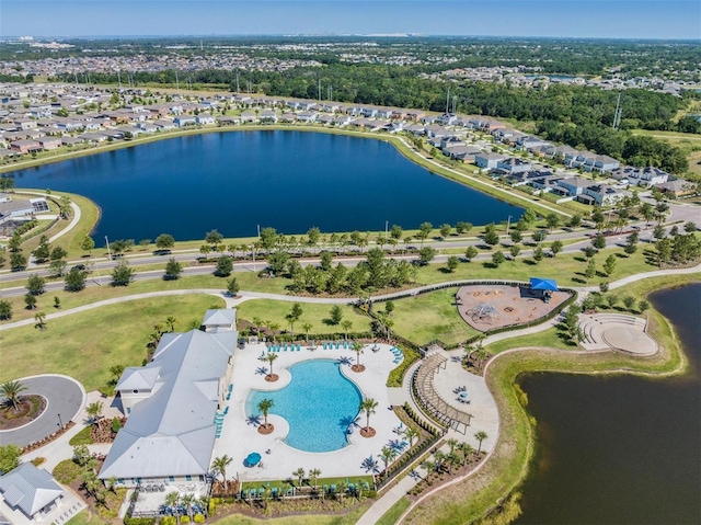 birds eye view of property with a water view