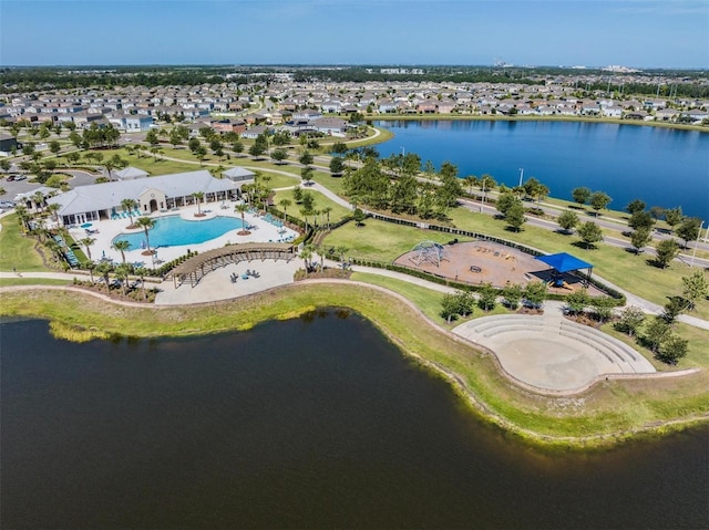 birds eye view of property featuring a water view and a residential view