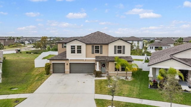 view of front of property featuring stucco siding, fence, a residential view, concrete driveway, and a front yard