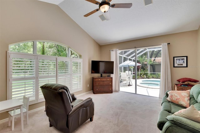 living area featuring a wealth of natural light and carpet flooring