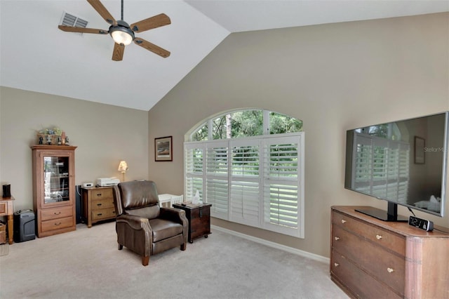 sitting room with visible vents, light carpet, high vaulted ceiling, a ceiling fan, and baseboards