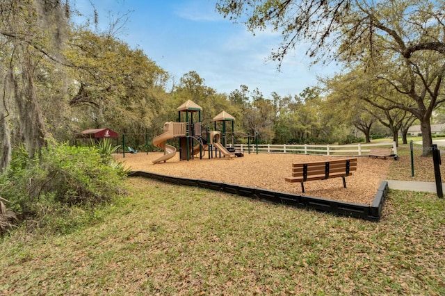 community jungle gym featuring fence