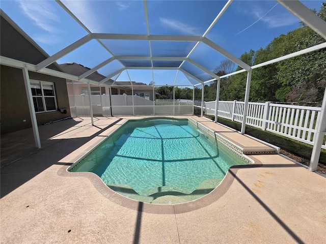 view of pool with a patio area, a fenced in pool, a lanai, and a fenced backyard