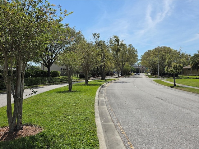 view of street featuring curbs and sidewalks