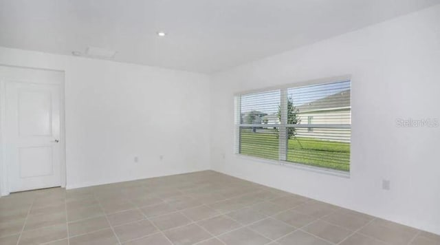 spare room with tile patterned flooring