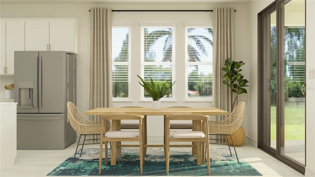 dining space featuring light wood-style floors