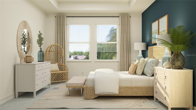 bedroom with light carpet and baseboards