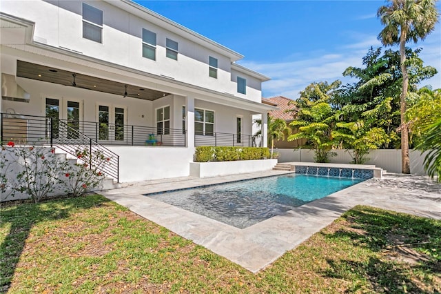 view of pool featuring a fenced in pool, a patio, a fenced backyard, and a ceiling fan