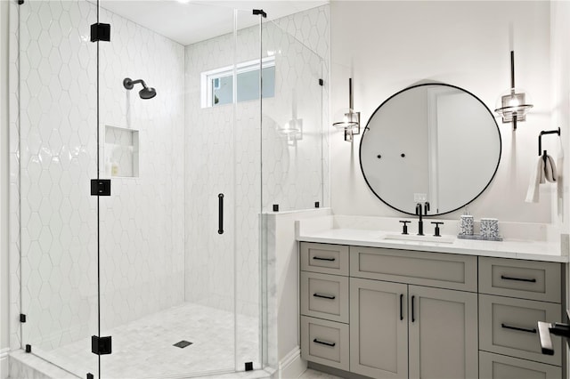 bathroom with a stall shower and vanity