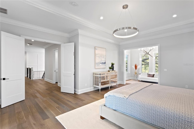 bedroom featuring recessed lighting, baseboards, wood finished floors, and ornamental molding