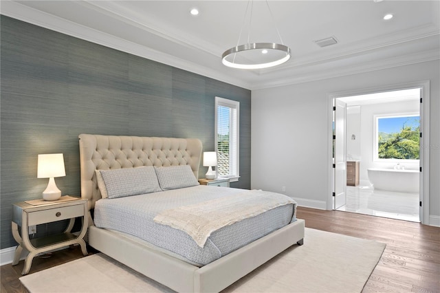 bedroom with crown molding, recessed lighting, wood finished floors, and baseboards