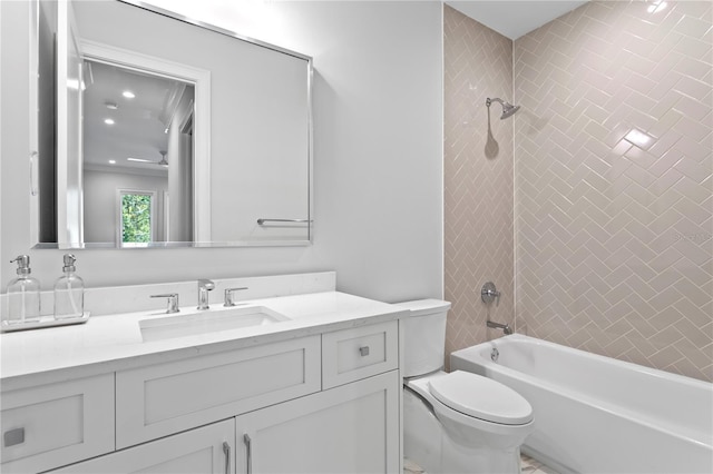 bathroom featuring toilet, tub / shower combination, and vanity