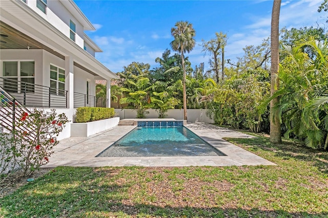 view of pool with a patio, a yard, a fenced backyard, and a fenced in pool