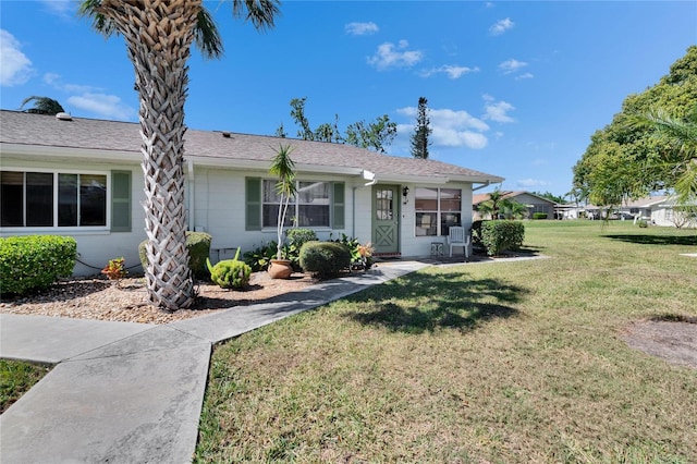 single story home with a front yard