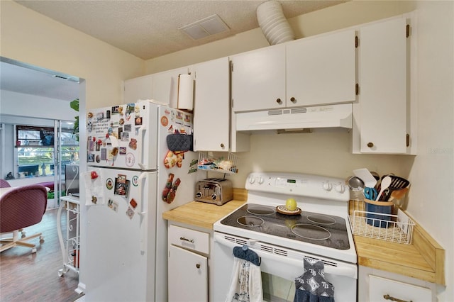 kitchen with visible vents, white cabinetry, under cabinet range hood, and white appliances