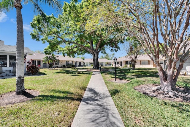 surrounding community with a lawn