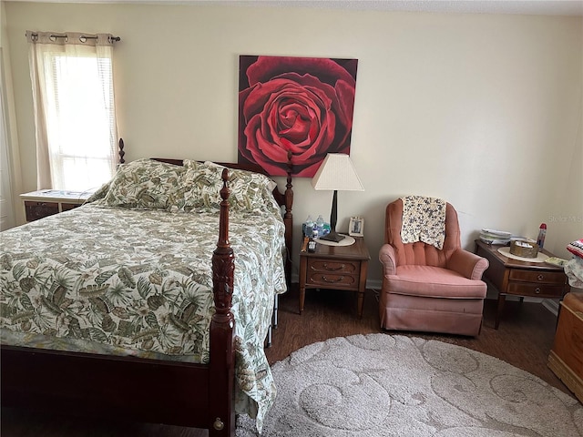 bedroom with wood finished floors