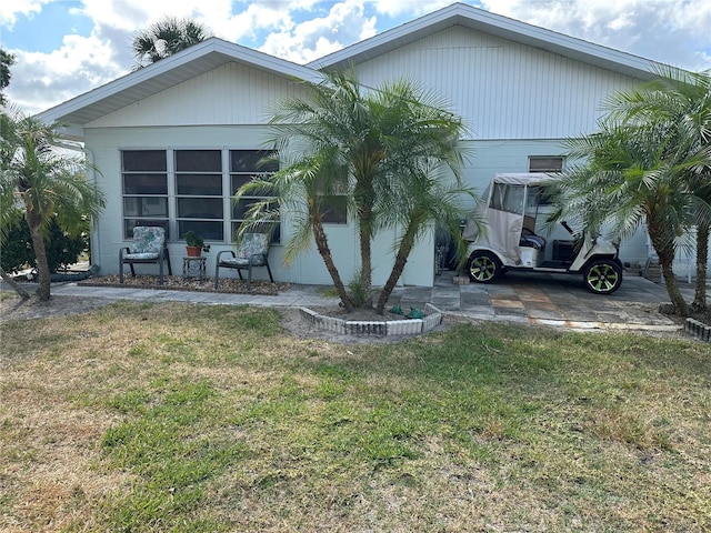 back of property with a yard