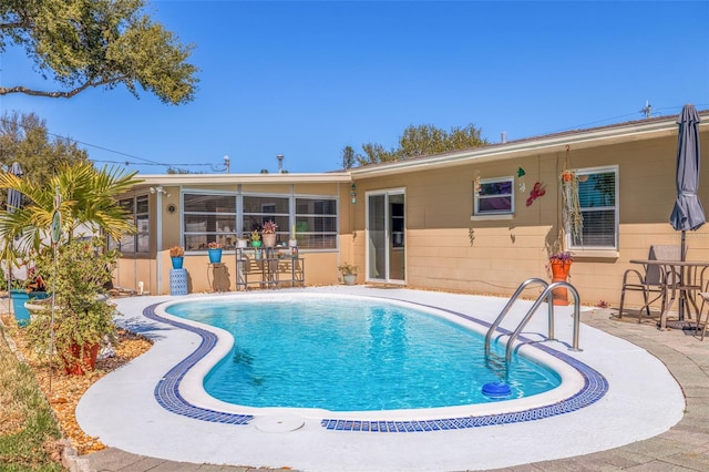 outdoor pool featuring a patio area