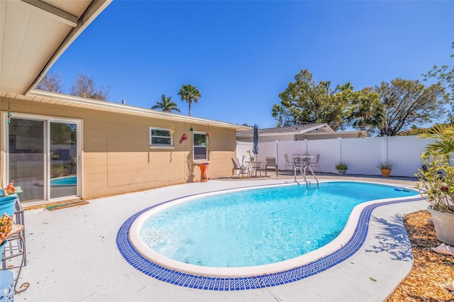 view of pool featuring a patio area, a fenced in pool, and a fenced backyard