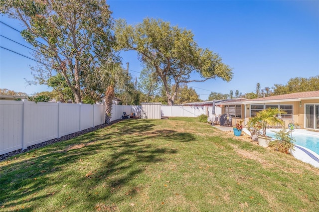 view of yard with a fenced backyard