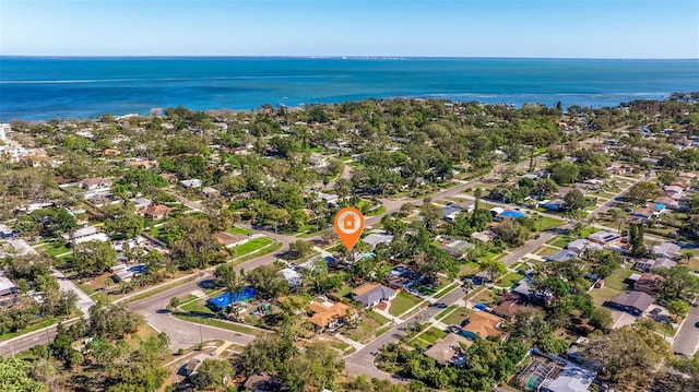 bird's eye view featuring a water view and a residential view