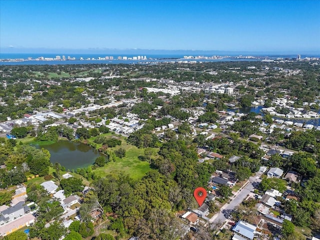 bird's eye view featuring a water view and a residential view