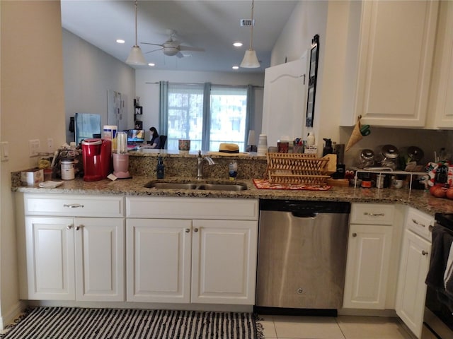 kitchen with dishwasher, white cabinets, light stone counters, and a sink