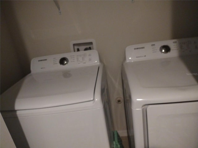 laundry room with washing machine and dryer and laundry area