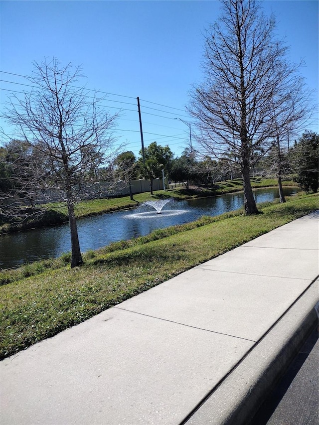 view of sport court with a water view