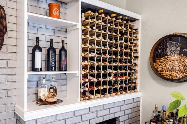 wine cellar featuring brick wall