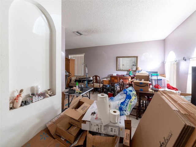 interior space featuring visible vents and a textured ceiling