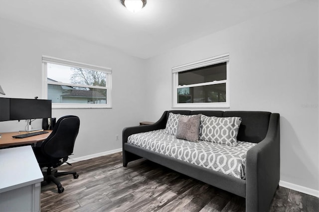 office area with baseboards and wood finished floors