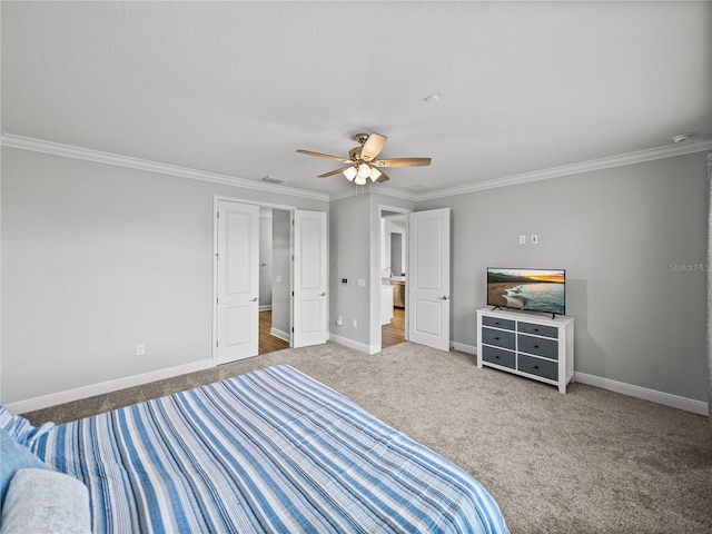 unfurnished bedroom featuring visible vents, carpet floors, baseboards, and ornamental molding