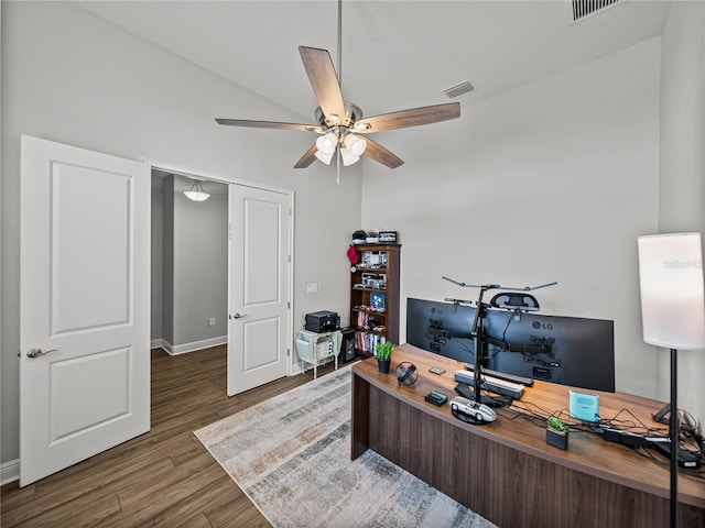 office featuring visible vents, baseboards, wood finished floors, and a ceiling fan