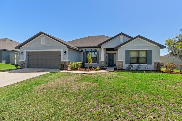 craftsman-style house featuring concrete driveway, an attached garage, stone siding, and a front lawn