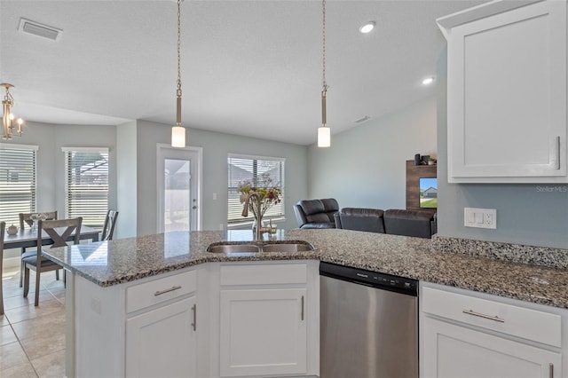 kitchen with dishwasher, light tile patterned floors, a wealth of natural light, and a sink