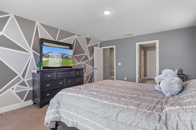 bedroom with visible vents and light carpet