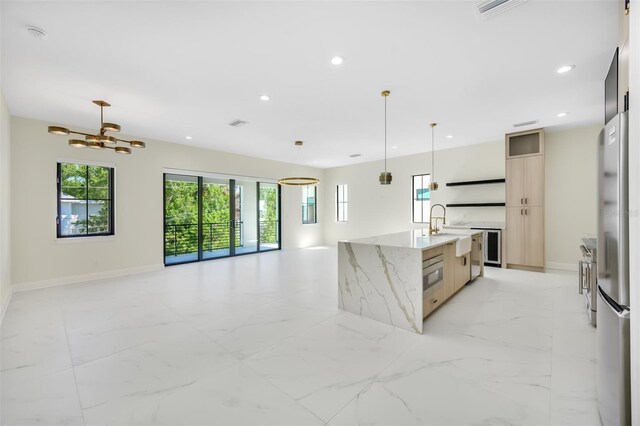 kitchen with recessed lighting, modern cabinets, open floor plan, and marble finish floor