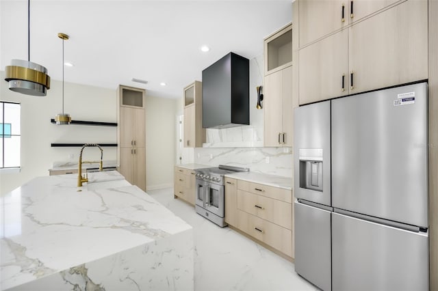 kitchen featuring tasteful backsplash, light brown cabinetry, appliances with stainless steel finishes, marble finish floor, and wall chimney exhaust hood