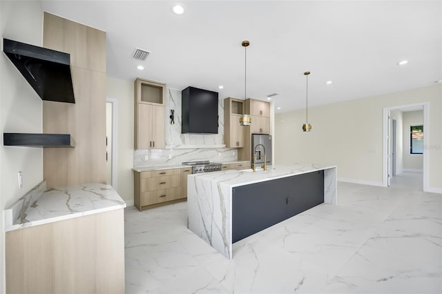 kitchen with light brown cabinets, wall chimney range hood, recessed lighting, marble finish floor, and modern cabinets