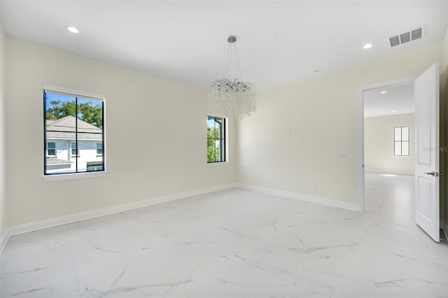 unfurnished room featuring recessed lighting, visible vents, baseboards, and marble finish floor